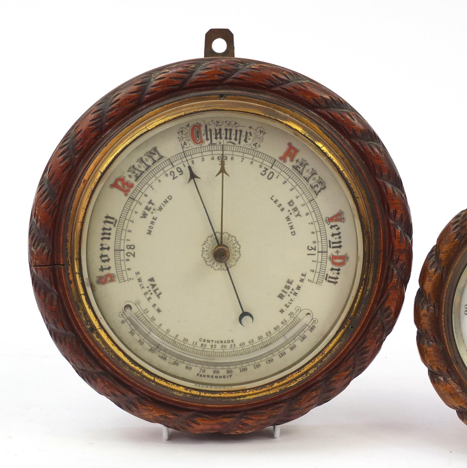 Two carved oak rope twist design wall barometers, the largest 27cm in diameter : For Further - Image 2 of 5