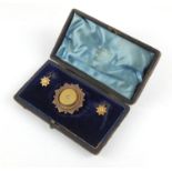 Victorian 15ct gold brooch and earrings, set with diamonds, housed in a W Sawdon fitted case, the
