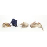 Royal Crown Derby cat paperweight, Carved lapis lazuli cat and two porcelain cat groups, the largest