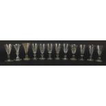 Twelve 18th/19th century faceted gin glasses including four with blade collars and knopped stems,