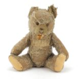 Antique straw filled teddy bear with jointed limbs, 45cm high : For Further Condition Reports,