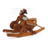 Child's carved wood rocking motorcycle, 90cm in length : For Further Condition Reports, Please Visit