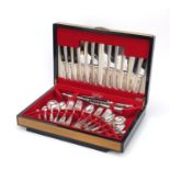 James Ryals & Co six place canteen of Sheffield silver plated cutlery, housed in a walnut canteen,