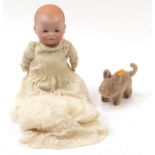 Vintage Steiff pig and an Armand Marseille bisque headed doll with composite limbs, the largest 38cm