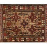 Rectangular Persian rug having an all over floral design to a brown ground, 179cm x 133cm : For