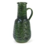 Large green pottery umbrella stand in the form of a jug, 52cm high : For Further Condition