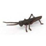 Japanese patinated bronze model of a grasshopper, seal marks to base, 12cm long : For Further