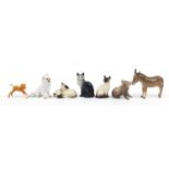 Beswick animals and a German porcelain dog including Donkey, Koala bear and Siamese cat, the largest