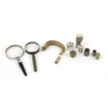 Walking stick handles/pommels and two magnifying glasses, including one silver pommel and a