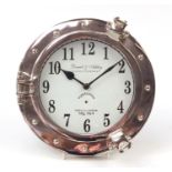 Silvered porthole design wall clock by Daniel & Ashley Clock Company, 24.5cm in diameter : For