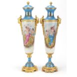 Large pair of Continental porcelain vases with covers and gilt metal mounts in the style of