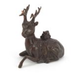 Japanese patinated bronze recumbent stag, impressed marks to the underside, 5.5cm high : For Further