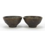 Pair of Chinese patinated bronze bowls with dragons, each 5.5cm in diameter : For Further