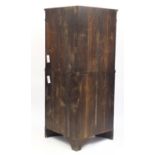 Early 19th century flame mahogany breakfront standing corner cabinet fitted with two panelled