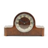Art Deco walnut chiming mantle clock by Gustav Becker, the circular dial having applied Arabic