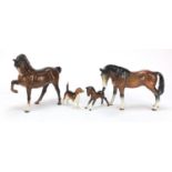 Two Beswick horses, dog and one other horse, the largest 24cm in length : For Further Condition