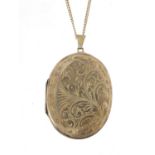 Oval silver locket on a silver necklace, the locket 5.6cm high, 19.4g : For Further Condition