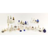 Antique and later glass scent bottles including Art Deco examples and one with a silver collar,