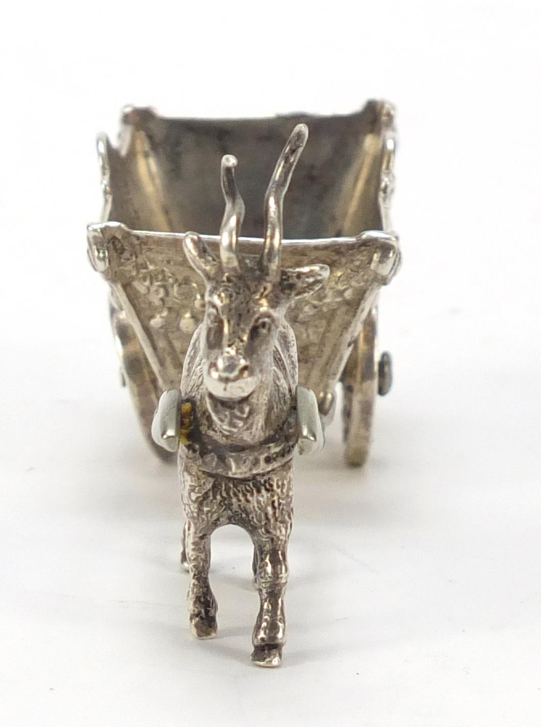 German silver model of goat pulling a cart with rotating wheels, impressed to the base, 11cm in - Image 5 of 8