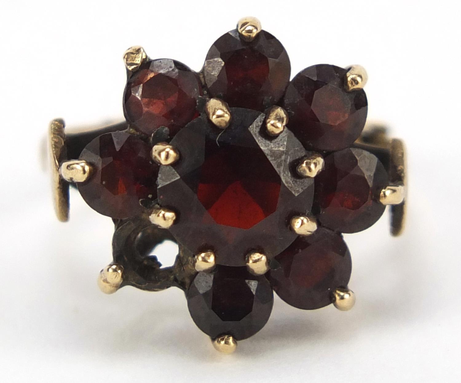 9ct gold garnet flower head ring, size N, 4.7g : For Further Condition Reports, Please Visit Our