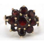 9ct gold garnet flower head ring, size N, 4.7g : For Further Condition Reports, Please Visit Our