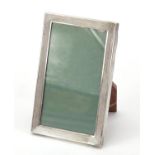 Rectangular silver easel photo frame with engine turned decoration, by Saunders & Mackenzie 1975,