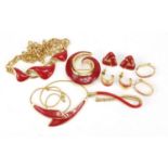 Vintage Monet red enamel jewellery comprising two necklaces, two brooches and three pairs of