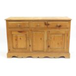 Pine sideboard fitted with three drawers above three cupboard doors, 87cm H x 138cm W x 43cm D : For