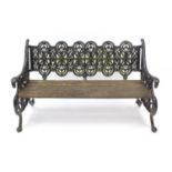 Victorian style cast iron three seater garden bench with wooden slats on paw feet, 84cm H x 138cm