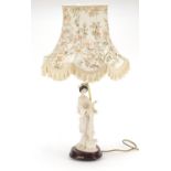Italian figural table lamp with a Geisha girl with plaque inscribed G Armani, overall 71cm high :
