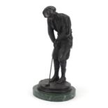 Patinated bronze figure of a golfer raised on a green marble base, 31cm high : For Further Condition