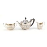 George VI silver three piece tea set with fluted body, by Goldsmiths & Silversmiths Company,