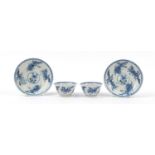 Pair of Chinese blue and white porcelain flower head design tea bowls with saucers, each hand