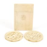 Victorian ivory card case and two Chinese Canton roundels carved with figures, the largest 9.5cm