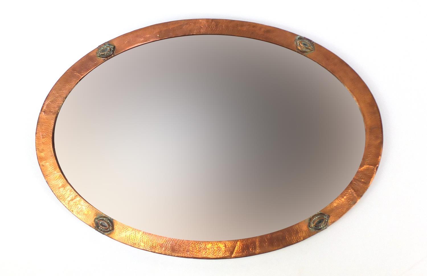 Arts & Crafts oval copper wall mirror with bevelled glass, 83cm x 58cm : For Further Condition