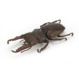 Japanese patinated bronze model of a herculean beetle with articulated body, bearing seal marks to