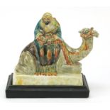 Stella R Crofts pottery model of Arab on camel back, signed and titled to the base, 27cm wide :