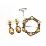 Circular silver citrine and marcasite brooch, 3cm in diameter and a pair of similar earrings, 9.6g :