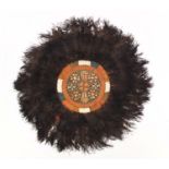 African tribal interest ostrich feather and leather panel, 70cm in diameter : For Further