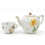 Herend porcelain bullet shaped teapot decorated with sprays of flowers together with a similar