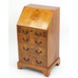 Yew bureau, the fall enclosing a fitted interior above a series of drawers, 96cm H x 51cm W x 42cm D