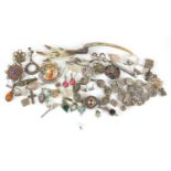 Silver and white metal jewellery including Eastern half stone set brooches and an eagles foot brooch