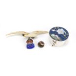 Objects including a plique-à-jour enamel and mother of pearl silver pill box and an ivory seagull