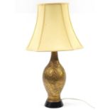 Gilt metal baluster table lamp decorated with flower and leaf decoration raised on circular footed