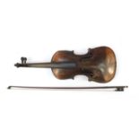 Old wooden violin with bow having mother of pearl frog and wooden travelling case, the violin