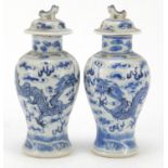 Pair of Chinese blue and white porcelain baluster vases with covers, each hand painted with