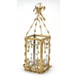 Ornate gilt metal mounted candle holder with glass panels, 63.5cm high : For Further Condition