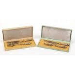 Two pairs of pierced silver coloured metal fish servers, cased : For Further Condition Reports,