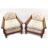 Victorian walnut framed double bergere three piece suite, each with carved scrolling arms on claw