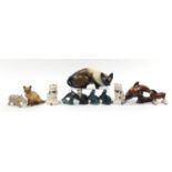 Collectable animals including Poole otters, pair of Staffordshire style seated cats and a large
